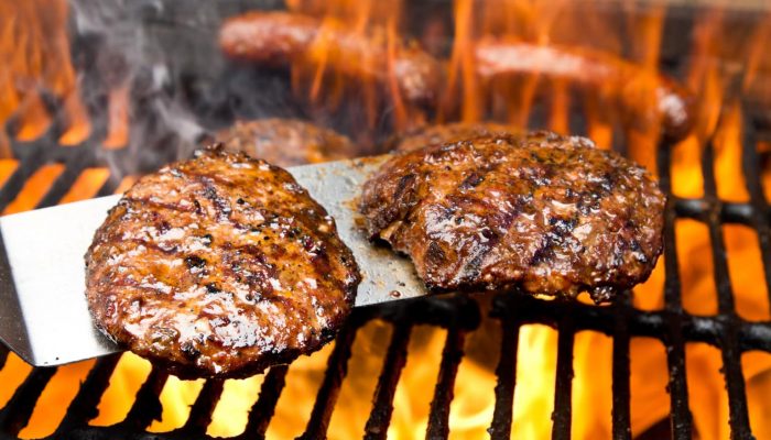 Burgers on Grill with Bratwurst and Flames